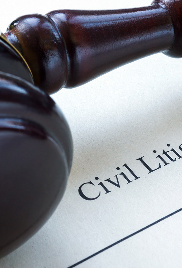 Close up of civil litigation document and gavel.