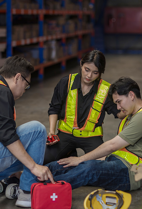 First aid support accident at work of worker at factory. Male wo